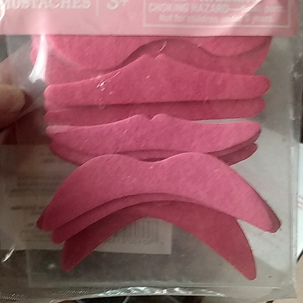 Pink stick on mustaches.